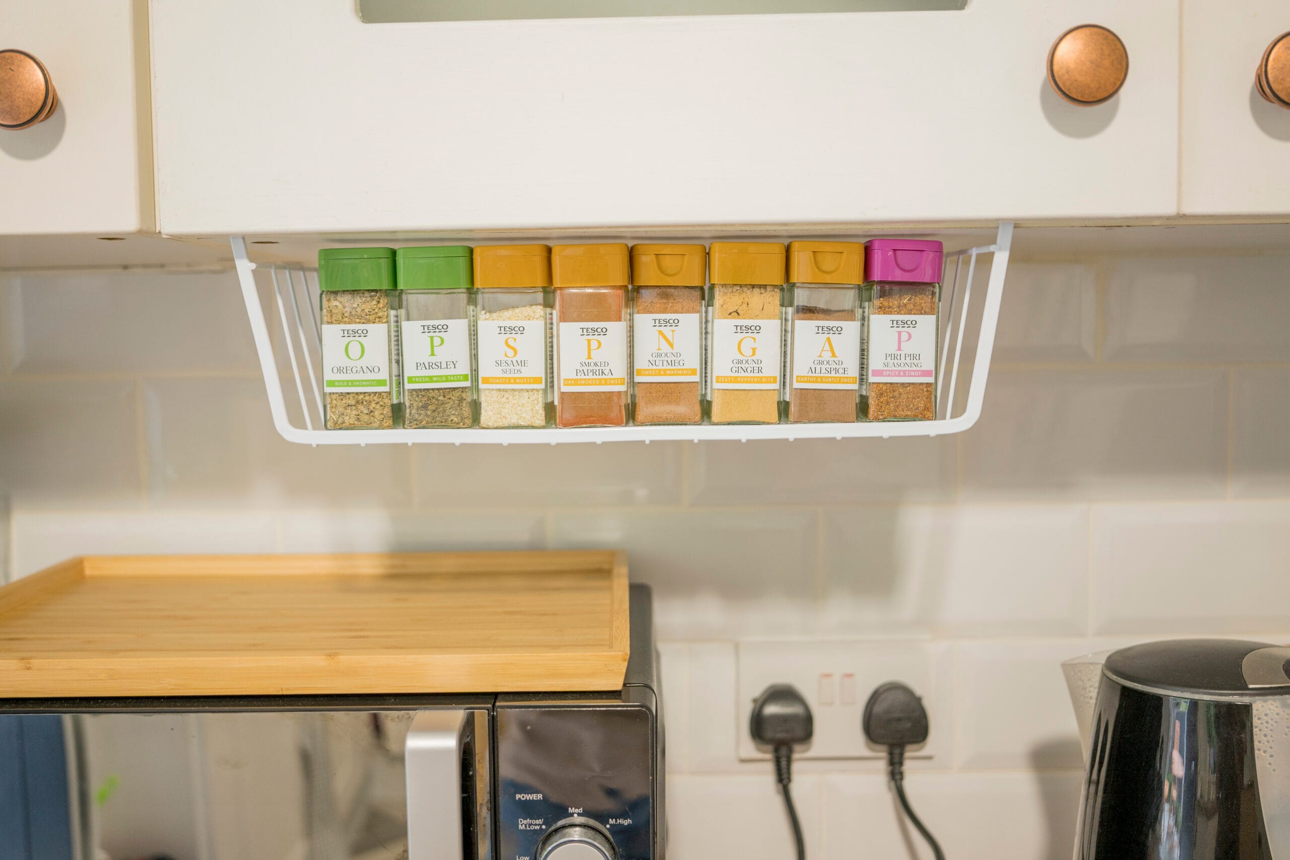 Herbs and spices stored neatly in a kitchen
